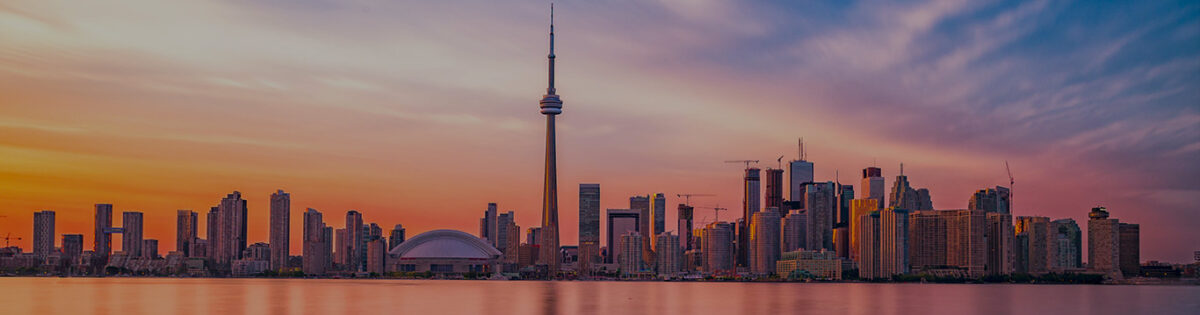 Toronto city skyline at sunset with the CN Tower prominently in view
