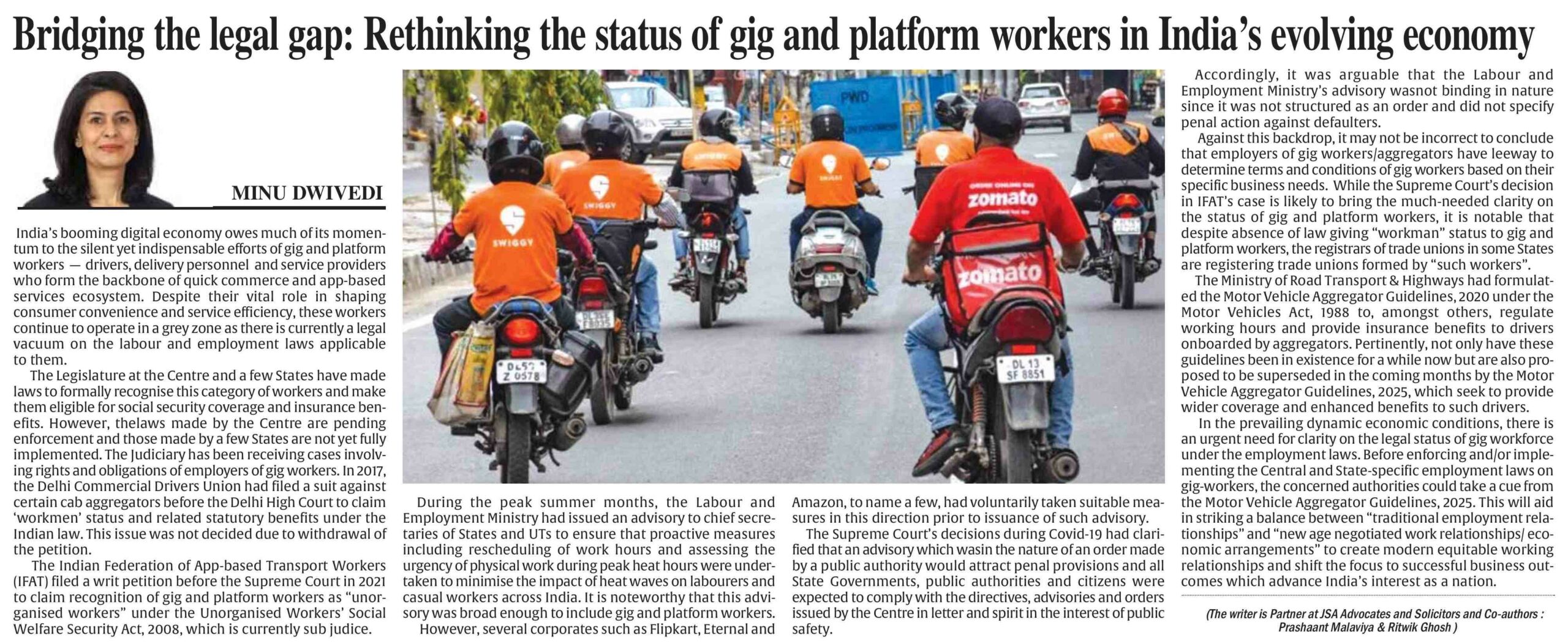 Gig economy delivery workers ride motorbikes for platforms like Zomato and Swiggy on a busy Indian road, highlighting the evolving status of platform workers discussed in the article.