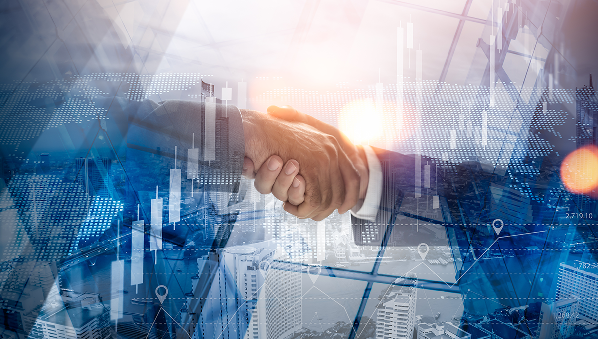 Two business professionals shaking hands over a cityscape with digital financial graphs overlayed.