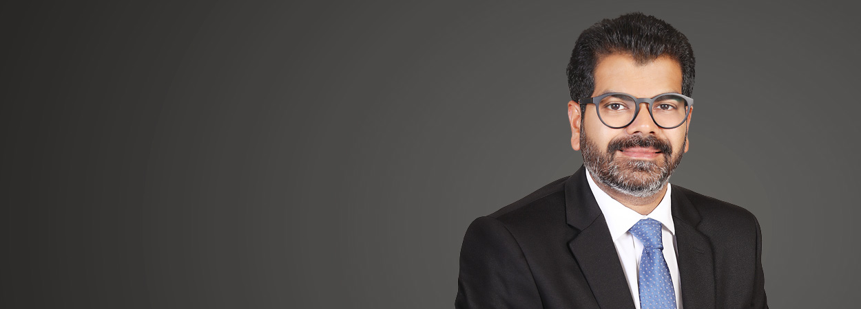Portrait of Akshat Jain, Partner at JSA, specializing in disputes, regulatory litigation, and energy sector advisory.